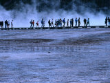 Hikers Walking along a Boardwalk at Midway Geyser Basin, Yellowstone National Park, USA Photographic Print by Brent Winebrenner