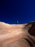Crossing a Sandstone Cliff at Devil's Garden, Grand Staircase-Escalante National Monument, Utah Photographic Print by Cheyenne Rouse