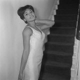 Shirley Bassey Wearing Silk Dress and Standing at the Foot of the Stairs at Home, 1962 Photographic Print