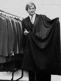 Roger Moore Holding a Length of Suiting Cloth, October 1970 Photographic Print