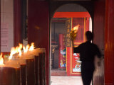 Man with Lit Paper in Chinese Temple, Chinatown, Jakarta, Indonesia Photographic Print by Peter Adams