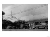 Hawaii - View of the Waikiki Theater Block Photograph Posters