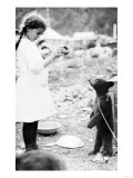 Girl Feeding Bear Cub in Seward, Alaska Photograph - Seward, AK Prints