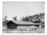 Men Sitting outside Log Cabin in South Dakota Photograph - South Dakota Poster