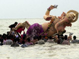 Devotees Immerse a Giant Clay Idol of Hindu Elephant-Headed God Ganesh into the Arabian Sea, Bombay Photographic Print
