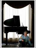 Music Legend Burt Bacharach Sitting at a Piano at the Berkeley Hotel, London Lámina fotográfica