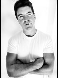 Pop Idol Judge Simon Cowell Poses Smoking a Cigarette at Max Clifford's Office London Photographic Print