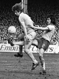 Brian Kidd of Manchester City Gets a Kick Through His Legs by Ipswich Defender George Burley Lámina fotográfica