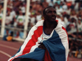 Linford Christie Athlete Drapped in Union Jack Flag Celebrates After Winning 100 Metres Gold Medal Photographic Print