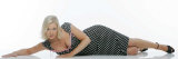 Suzanne Shaw Wearing a Black Polka Dot Dress with Pink Trimming Lying on the Floor Photographic Print