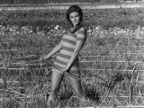 Actress Raquel Welch on Location For Film Shoot Wearing Striped Mini Dress and Holding Pitchfork Fotografie-Druck