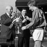 United Skipper Denis Law Receives the League Championship Trophy from League President Joe Richards Photographie