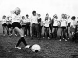 Miss Eva Haralsted Takes a Penalty Shot under the Watchful Eye of Fiancee George Best Photographie