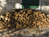 Wood Pile Against a Stone Wall Lámina fotográfica por Todd Gipstein Wood Pile Against a Stone Wall Lámina fotográfica por Todd Gipstein