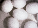 Six White Eggs Boil in Water Lámina fotográfica por Brian Gordon Green