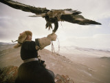 Kazakh Hunter Strains to Support a Golden Eagle Fotografie-Druck von David Edwards