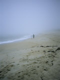 Mother and Child Walk Hand in Hand on a Misty Beach Photographic Print by Vlad Kharitonov