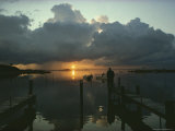 Small Fishing Boats Return to Dock as Clouds Gather at Sunset Photographie par Skip Brown