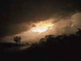Car Travels a Lonesome Road with a Storm Approaching Photographic Print by David Evans