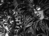 Carnival Masks in Black and White Displayed on a Wall in Venice Photographic Print by Todd Gipstein