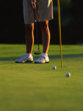 Golfer Putting on a Green in Afternoon Light Photographic Print by Michael Melford Golfer Putting on a Green in Afternoon Light Photographic Print by Michael Melford