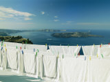 Laundry Hanging Out To Dry with a Scenic Hilltop View of the Water Photographie par Michael Melford