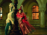 Carnivale Figures Leaning Against Lamp-Post Photographie par Ryan Fox