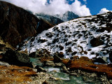 Stream and Snow-Covered Hillside at the Village of Machhermo Photographie par Richard I'Anson