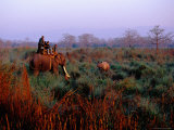 Elephant Carrying Tourists on Safari Photographie par Richard I'Anson