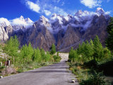 Road of the Karakoram Highway Leading Towards Cloud-Swathed Mountains Photographic Print by Lindsay Brown