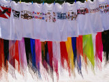 T-Shirts and Sarongs for Sale at Stall on Beach at Long Bay Photographie par Richard I'Anson