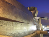 Dusk City Lights Reflect Off Guggenheim Museum Photographic Print by Dominic Bonuccelli