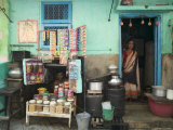 Husband and Wife Outside their House That Acts as a Shop Photographic Print by Gavin Quirke