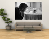 Sen. Jack Kennedy Admiring Baby Caroline as She Lies in Her Crib in Nursery at Georgetown Home Mural por Ed Clark