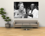 Woman Lighting a Cigarette from a Candle Held by a Waiter at the Piedmont Ball Wall Mural by Paul Schutzer