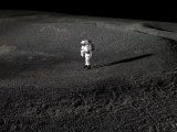 Spacesuit Engineer Simulates Work Inside a Crater in Johnson Space Center's Lunar Yard Photographic Print by Stocktrek Images 