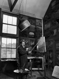 Former PM Winston Churchill Smoking a Cigar in His Studio Dressed in His Blue RAF Siren Jump Suit Premium Photographic Print by Hans Wild