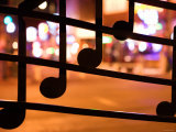 Close Up of Artistic Wrought Iron Musical Notes at Night Photographic Print