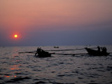 Silhouetted Boats on Lake Tanganyika, Tanzania Photographic Print by Kristin Mosher