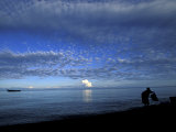 Silhouetted Woman on Lake Tanganyika, Tanzania Photographic Print by Kristin Mosher