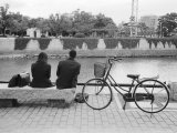 Couple by the Kyobashigawa River, Hiroshima, Japan Photographic Print by Walter Bibikow