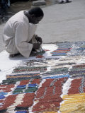 Nubian Jewelry Vendor and Boat on the Banks of Lake Nasser, Aswan, Egypt Photographic Print by Cindy Miller Hopkins