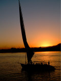 Felucca Silhouetted Against Setting Sun over the Nile at Luxor, Egypt Photographic Print by Cindy Miller Hopkins