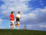 Middle-Aged Couple Jogging Together Photographic Print by Bill Bachmann