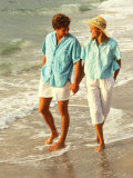 Middle-aged Couple Walking on the Beach Photographic Print by Bill Bachmann