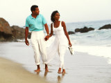 Black Couple Walking Together on the Beach Photographic Print by Bill Bachmann