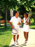 African American Couple Walking Together after Tennis Match Photographie par Bill Bachmann