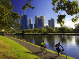 Cyclists, Yarra River and CBD, Melbourne, Victoria, Australia Photographic Print by David Wall