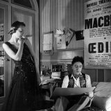 Jean Cocteau Sketching Model Elizabeth Gibbons in a Chanel Dress in His Hotel Bedroom Premium fotoprint van Roger Schall