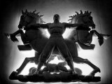 Statue of Man and Horses Being Lit from Behind at the New York World's Fair Lámina fotográfica por David Scherman